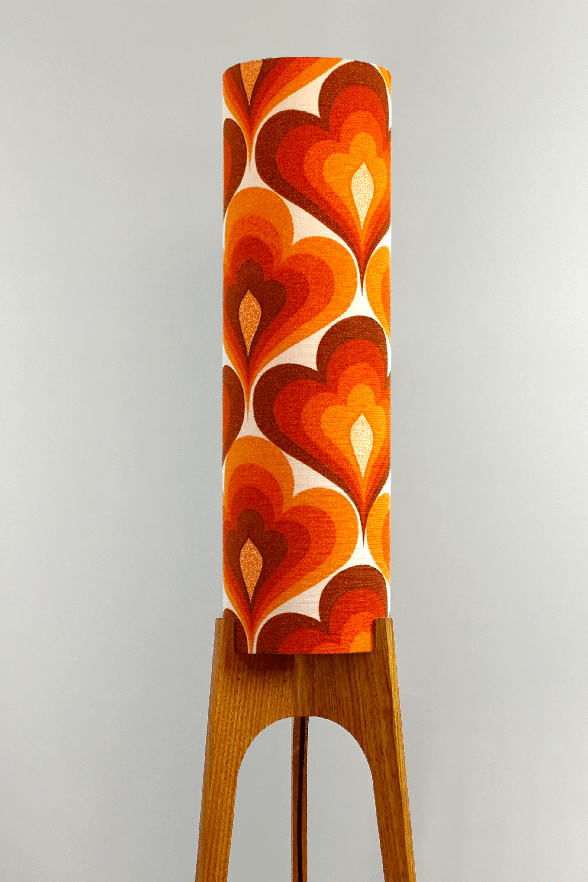 70s Love - Archie Rocket floor lamp with a vibrant orange and red heart-patterned shade made with authentic vintage fabric