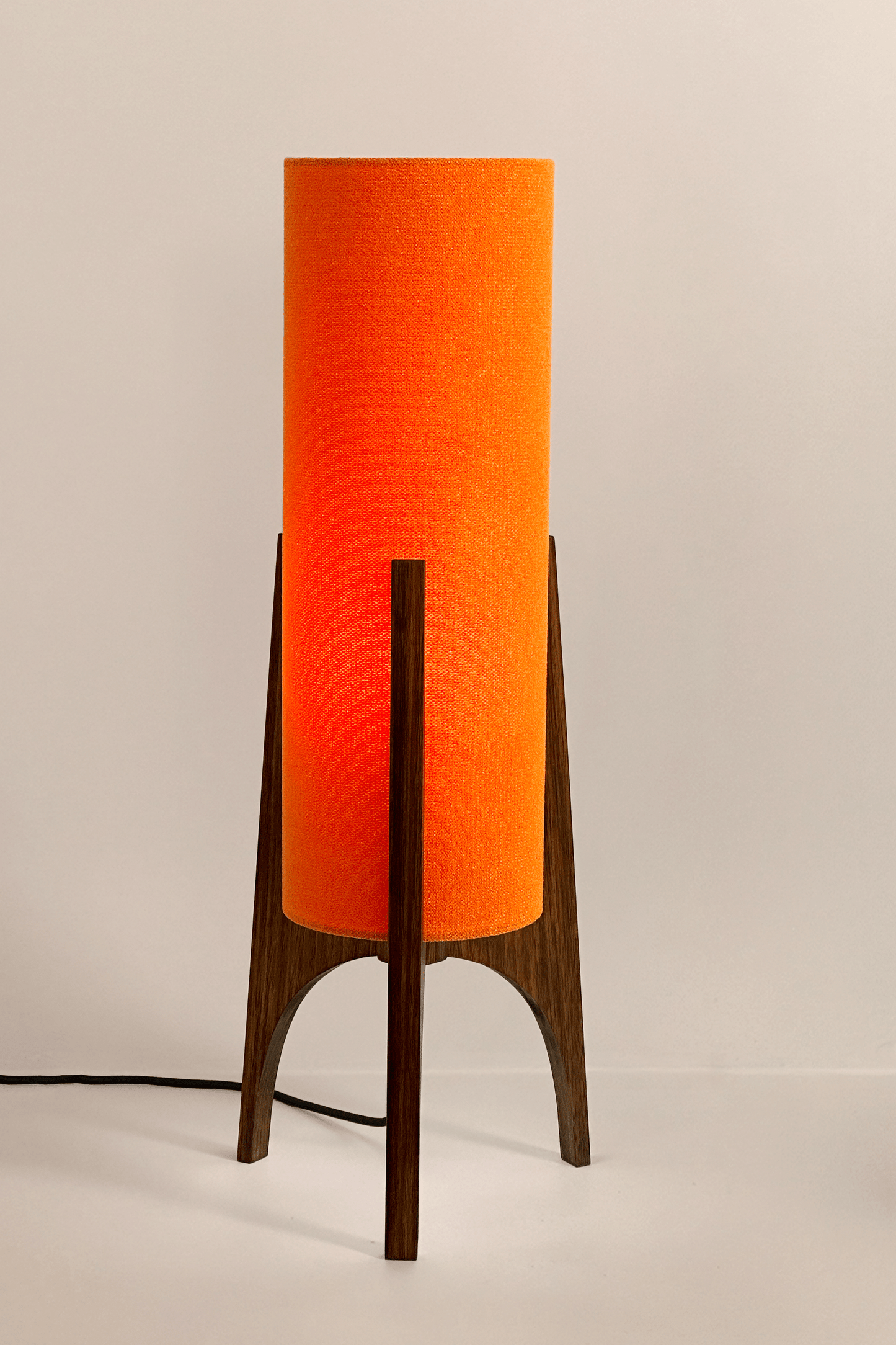 Orange Archie Rocket Table lamp with a handmade wooden base and recycled fabric shade.