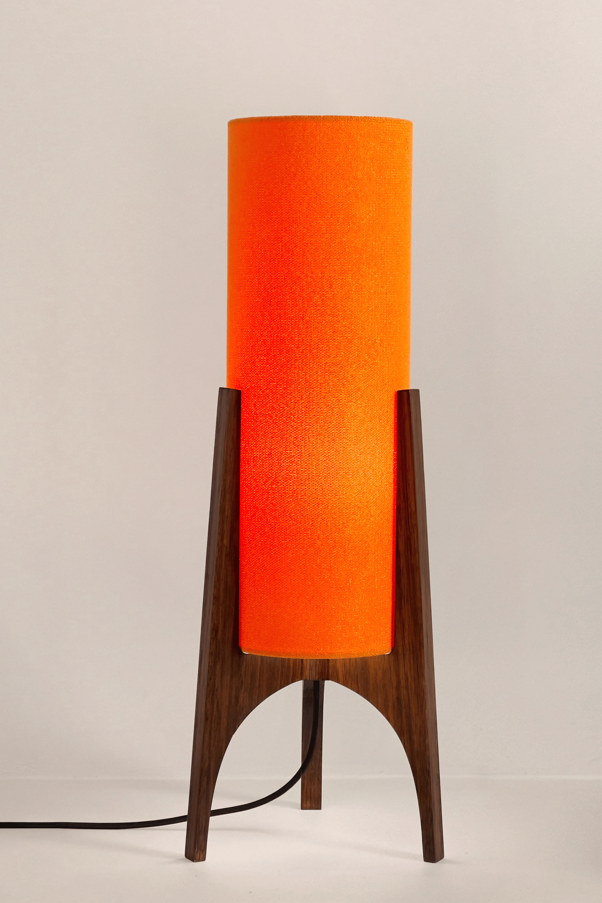 Orange Archie Rocket Table lamp with a handmade wooden base and recycled fabric shade.