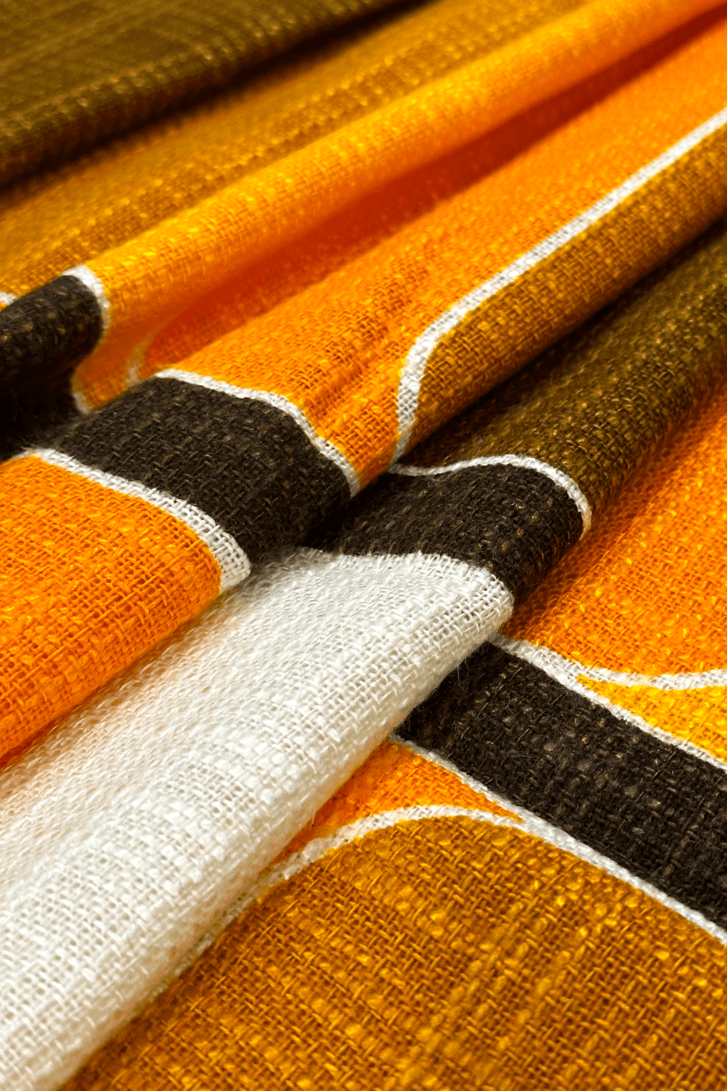 authentic 70's vintage fabric with orange and brown stripes on a white background