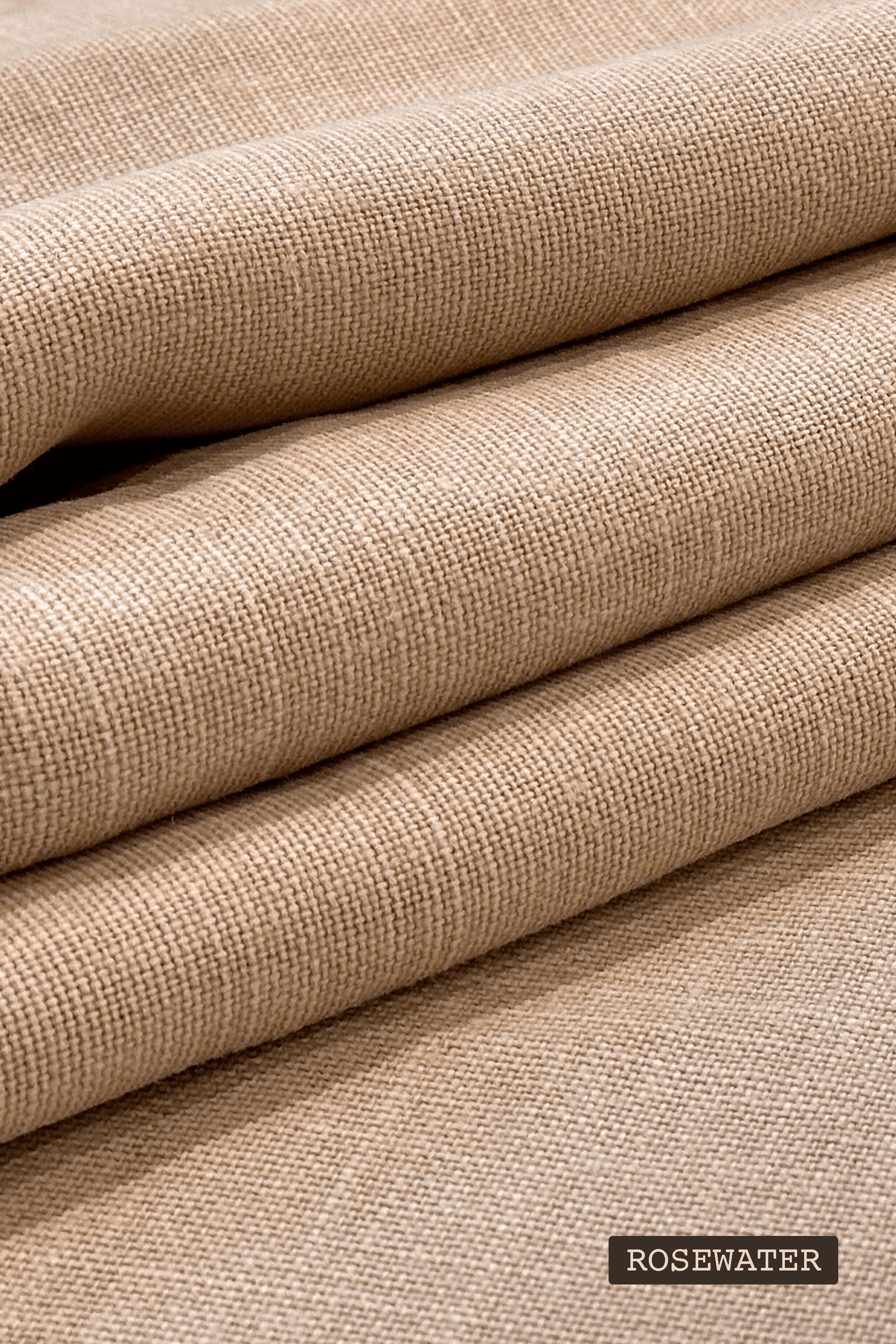 Close-up of premium linen fabric with 'Rosewater' label