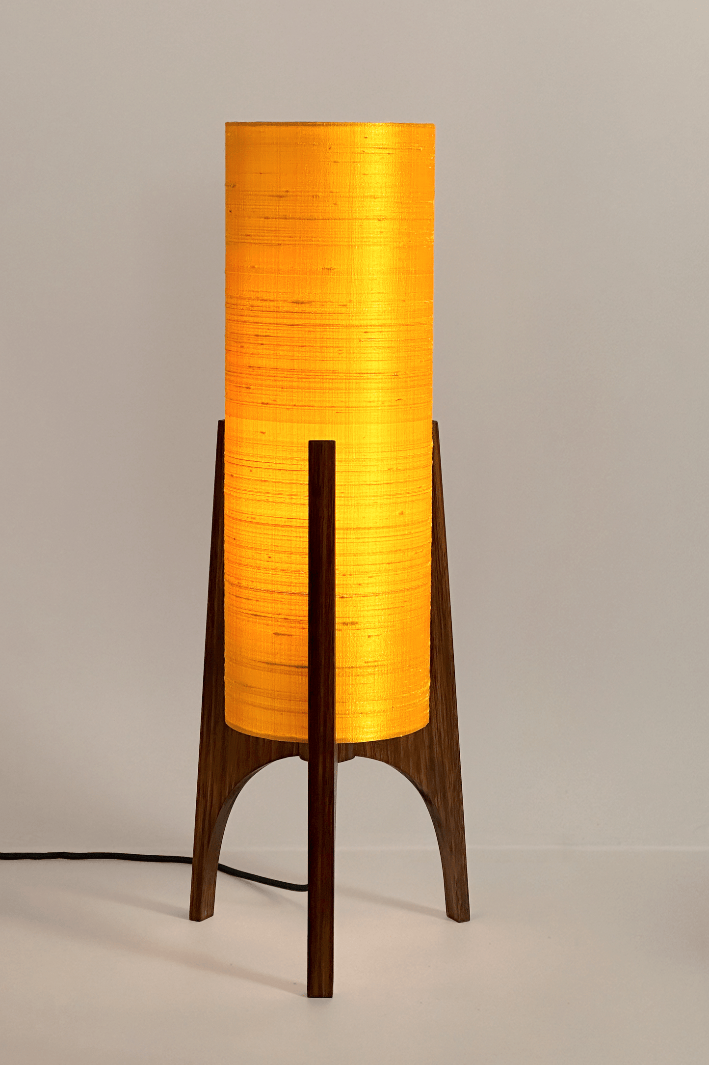 Handmade Wooden Rocket Table Lamp with cylindrical handmade lampshade in premium raw silk, available in Saffron, Marigold, and Hibiscus colour options