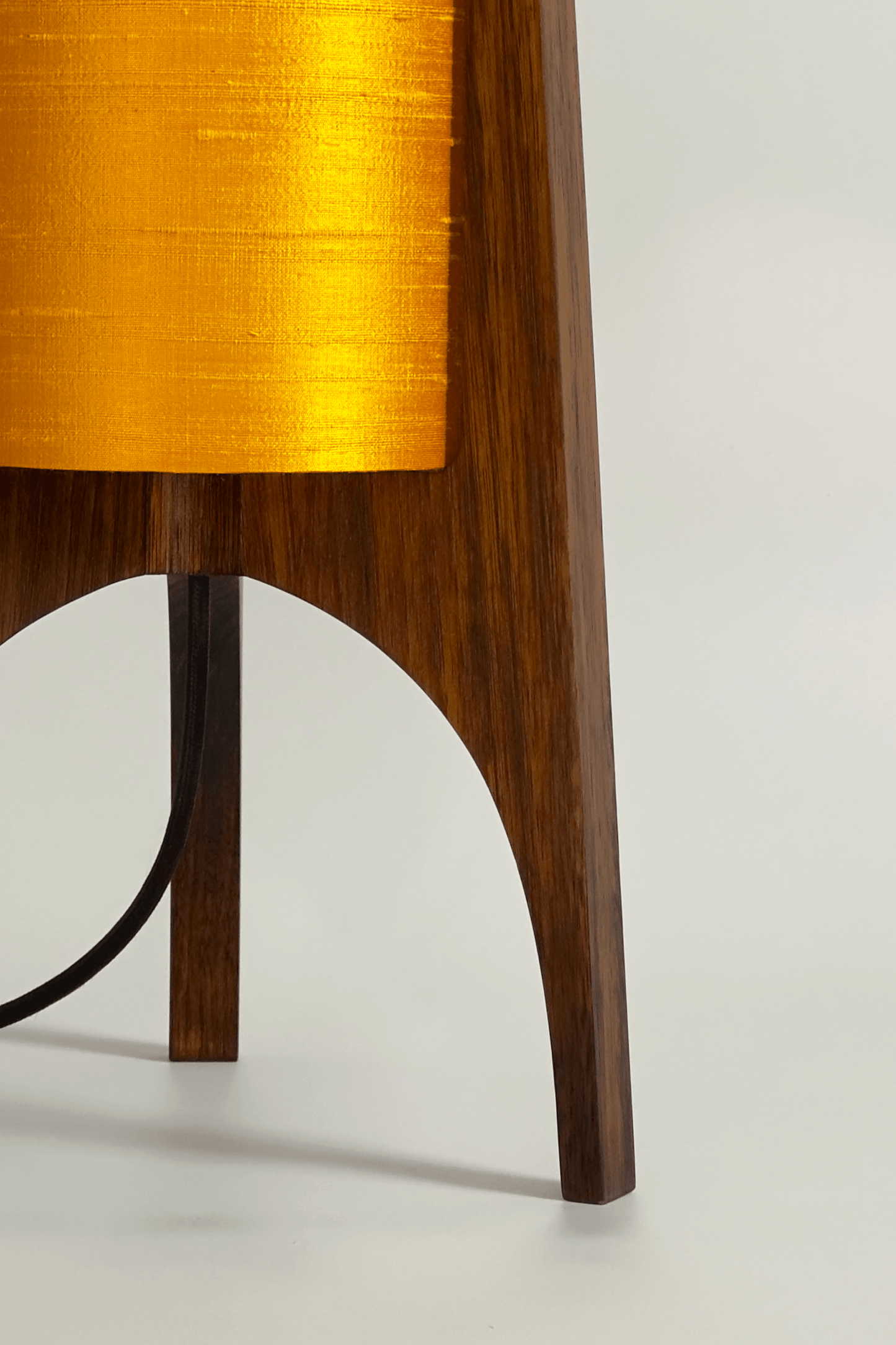 close up Handmade Wooden Rocket Table Lamp with cylindrical handmade lampshade in premium raw silk, available in Saffron, Marigold, and Hibiscus colour options