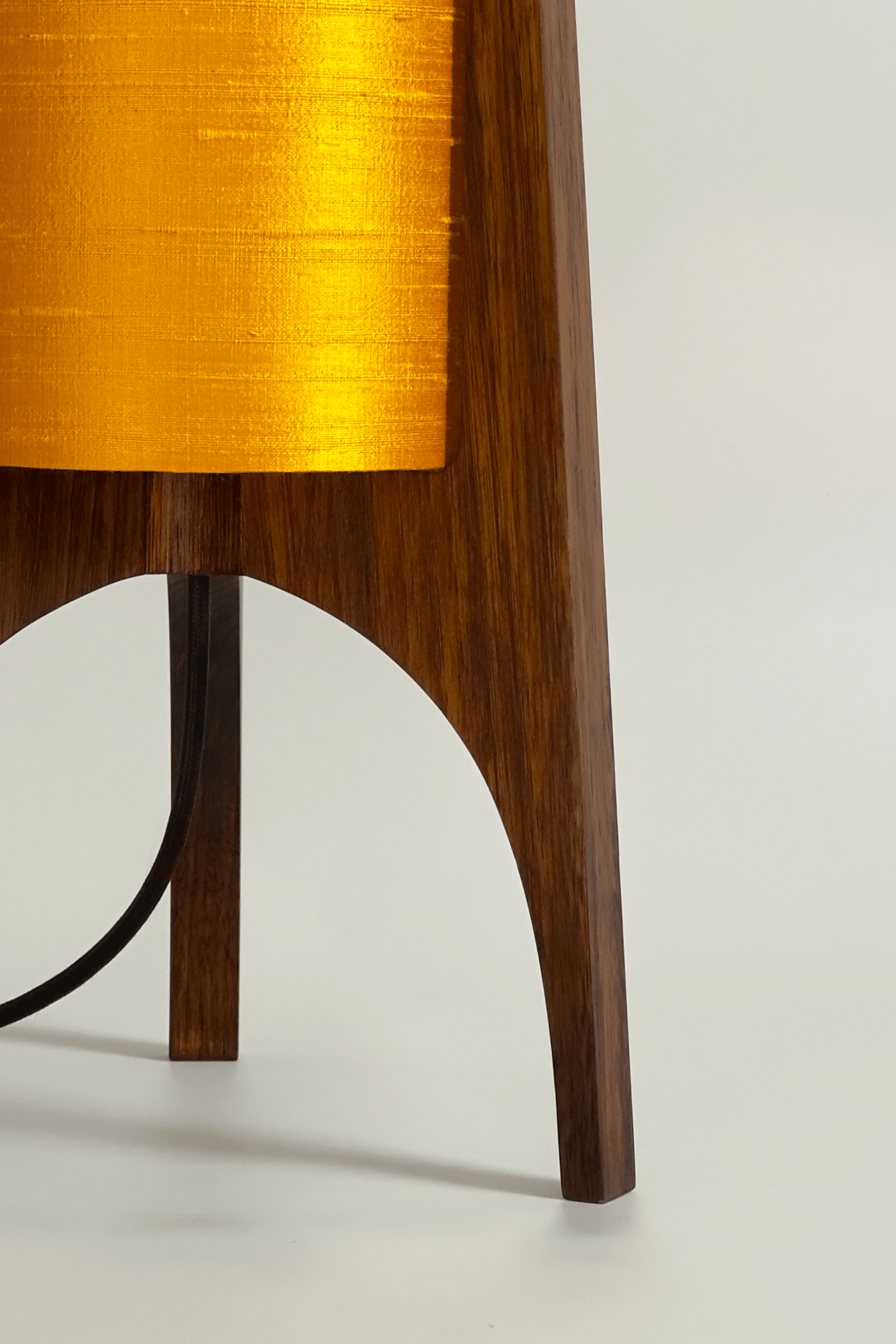 close up Handmade Wooden Rocket Table Lamp with cylindrical handmade lampshade in premium raw silk, available in Saffron, Marigold, and Hibiscus colour options