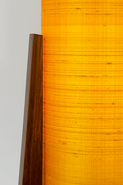 Close up Handmade Wooden Rocket Table Lamp with cylindrical handmade lampshade in premium raw silk, available in Saffron, Marigold, and Hibiscus colour options