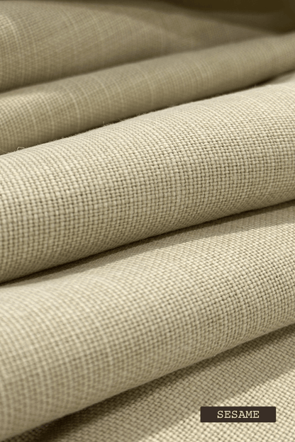 Close-up of linen fabric swatches with 'SESAME' label