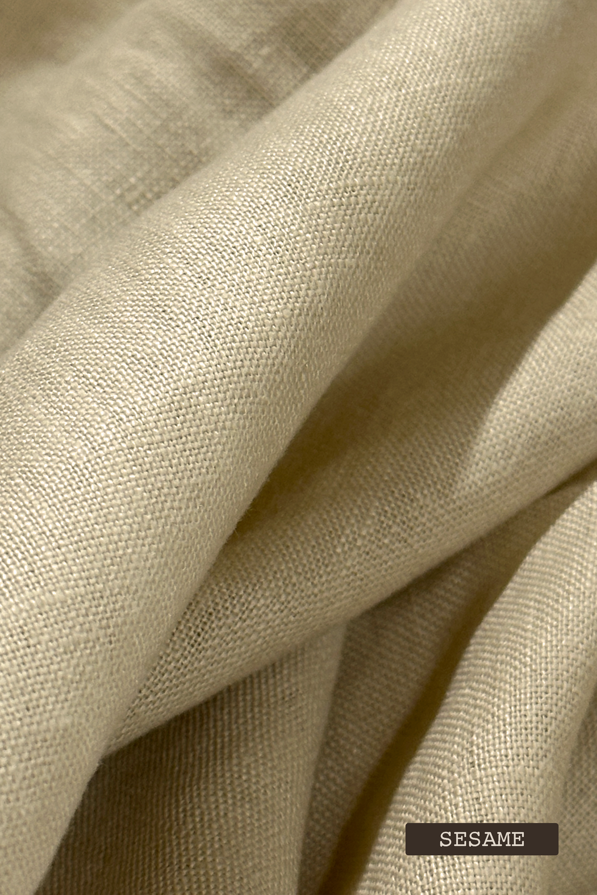 Close-up of linen fabric swatches with 'SESAME' label