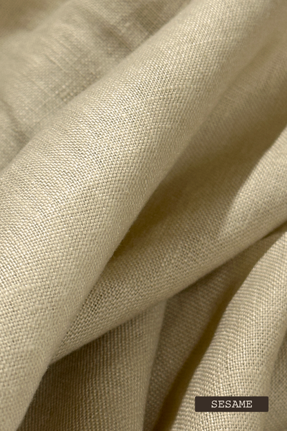 Close-up of linen fabric swatches with 'SESAME' label