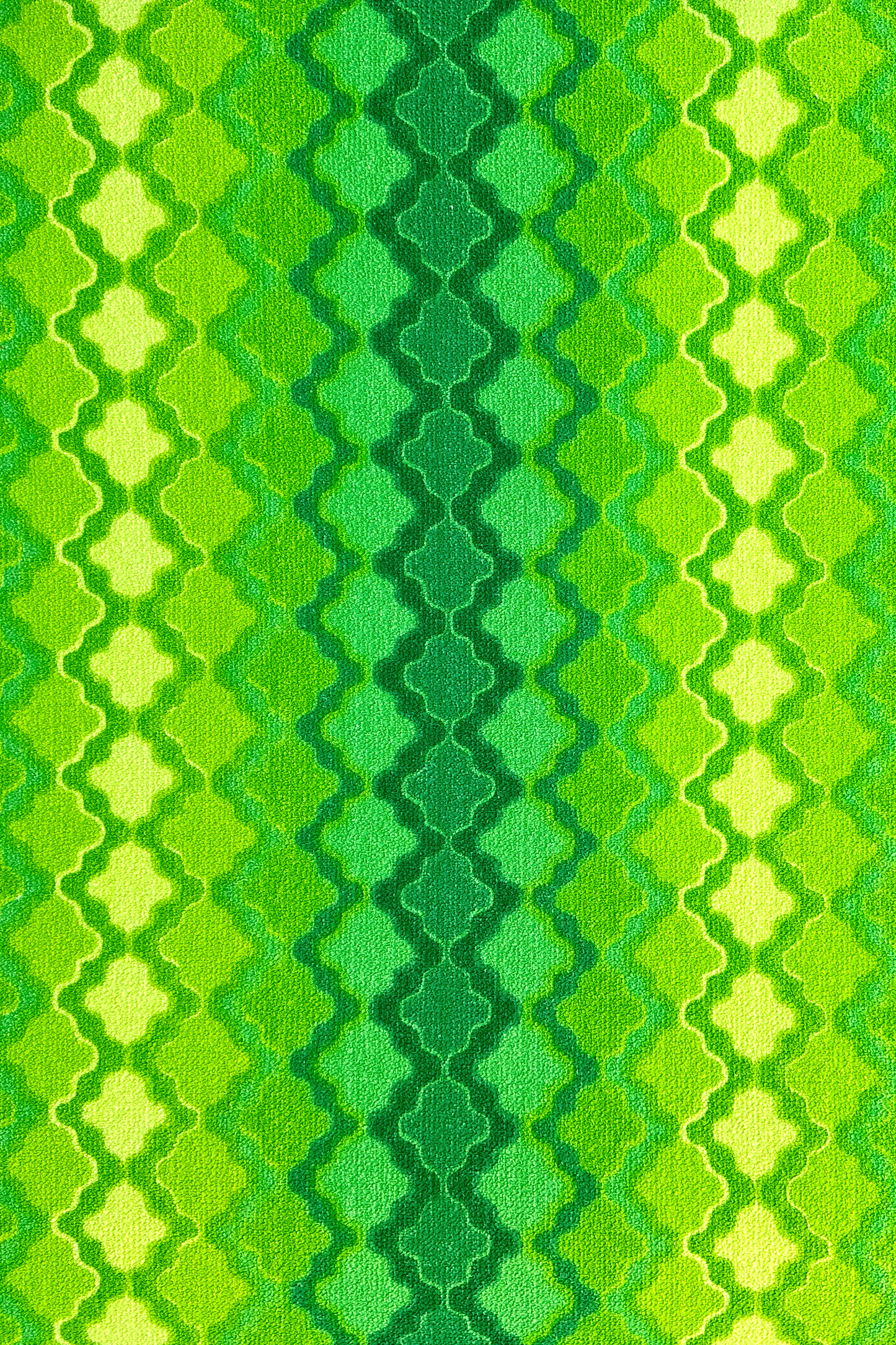 Vintage terry cloth fabric in green and yellow geometric patterns.