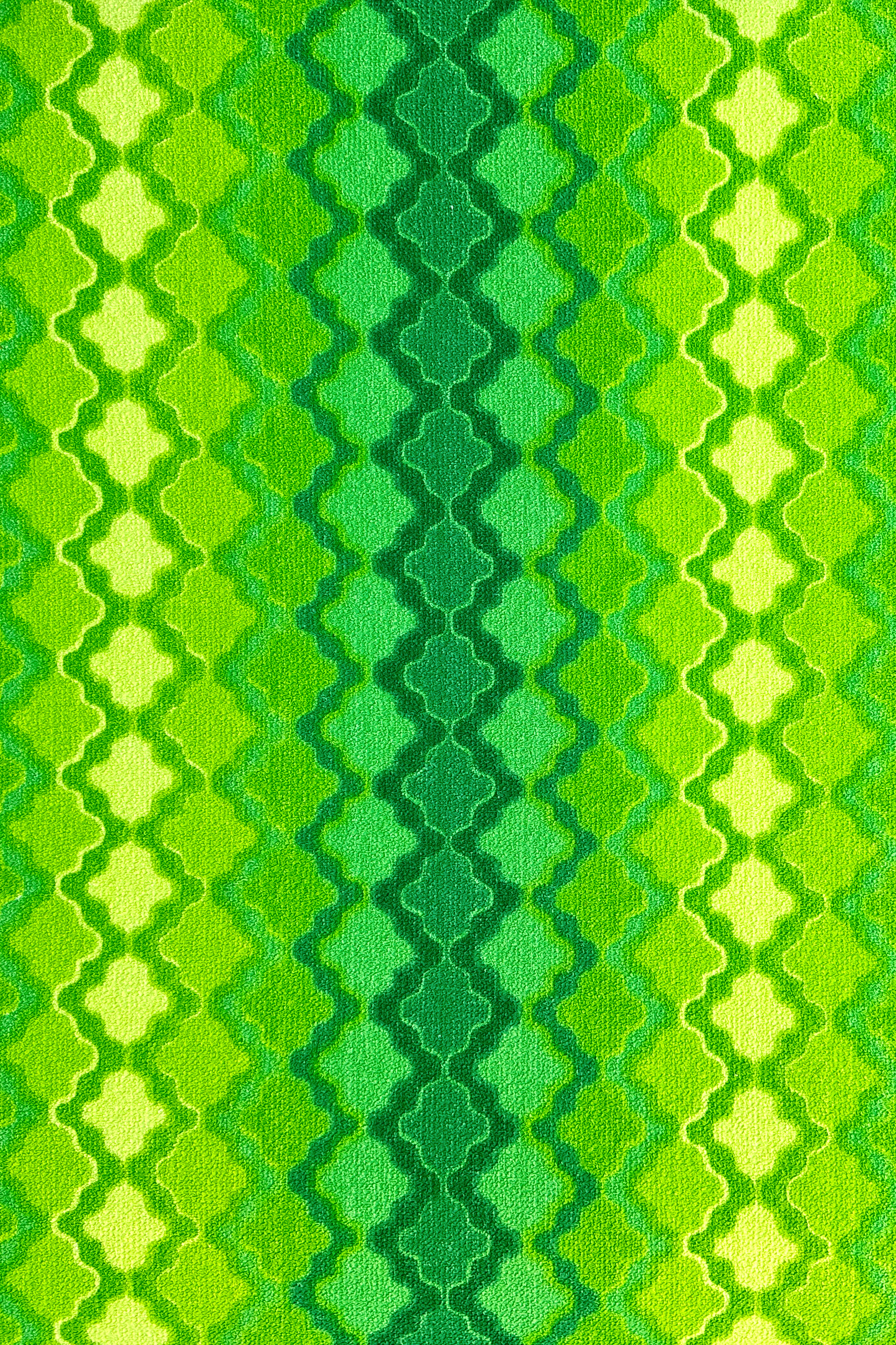 Vintage terry cloth fabric in green and yellow geometric patterns.