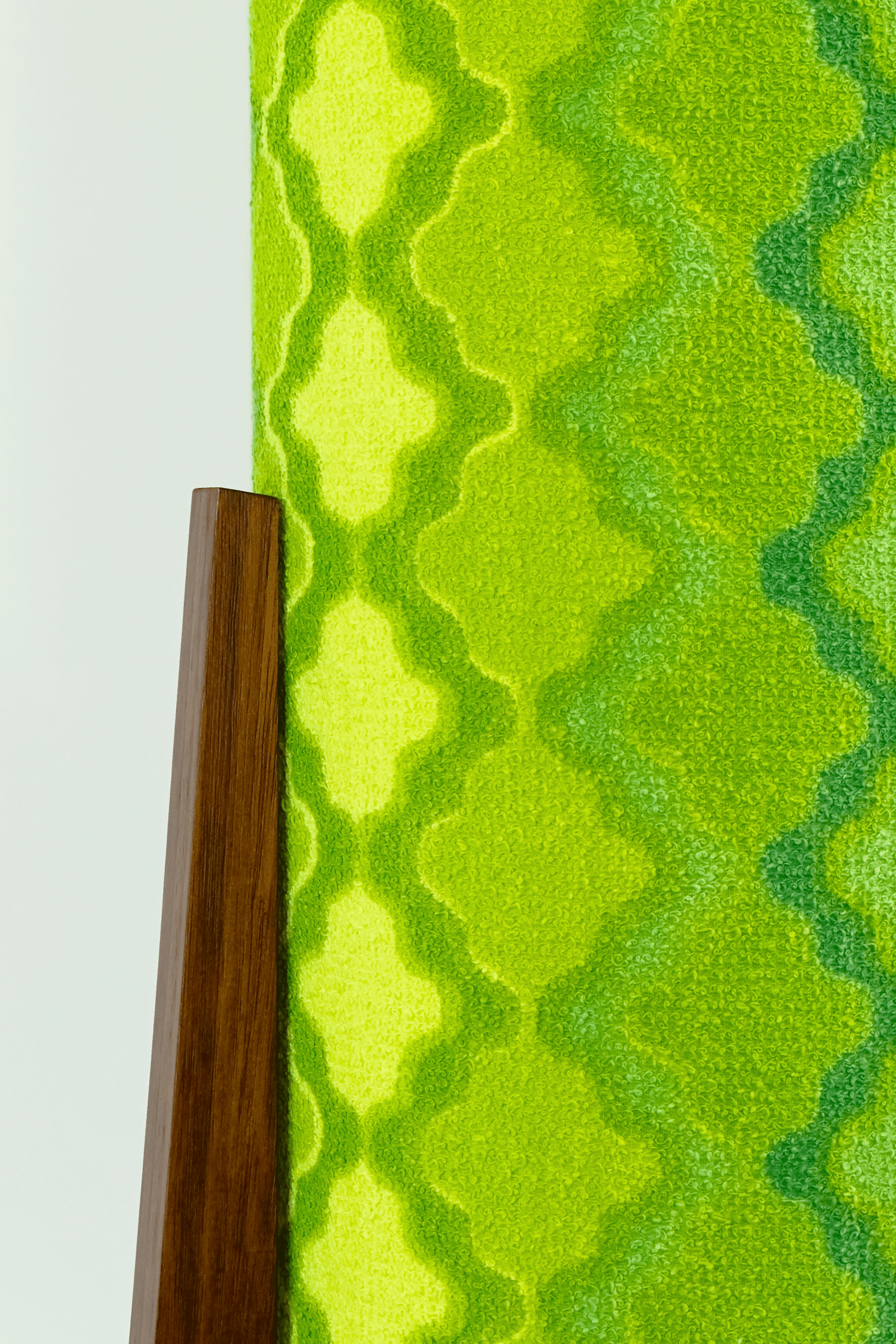 Close-up of Handmade Archie Rocket Table Lamp with yellow-green geometric patterns lampshade made from vintage terry cloth and hardwood base