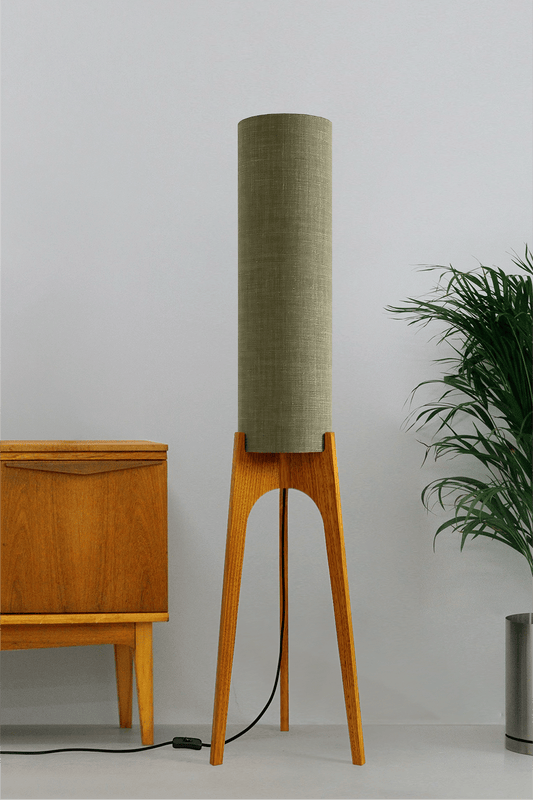 Tussock - Archie Rocket Floor lamp with wooden base and green fabric shade in a minimalistic setting.
