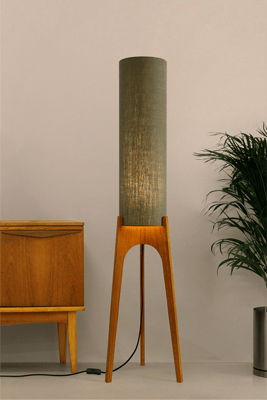 Tussock - Archie Rocket Floor lamp with wooden base and green fabric shade in a minimalistic setting.