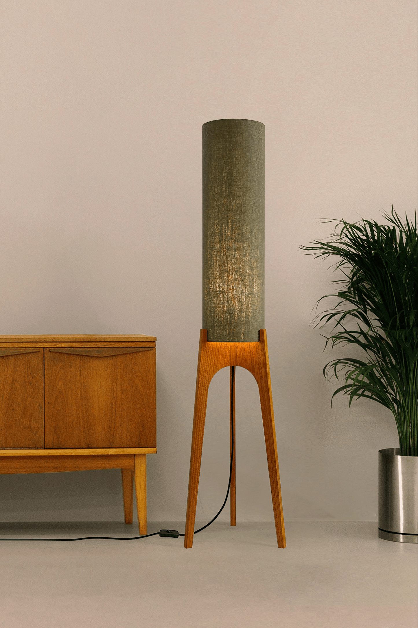 Tussock - Archie Rocket Floor lamp with wooden base and green fabric shade in a minimalistic setting.