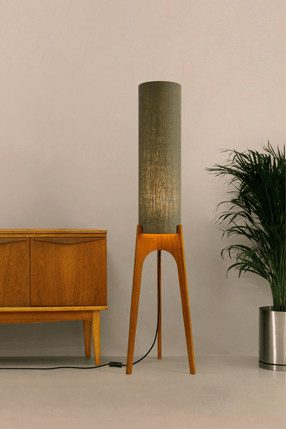 Tussock - Archie Rocket Floor lamp with wooden base and green fabric shade in a minimalistic setting.