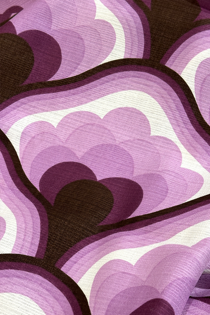 Viola - Close-up of viola vintage fabric with purple, brown, and white geometric pattern