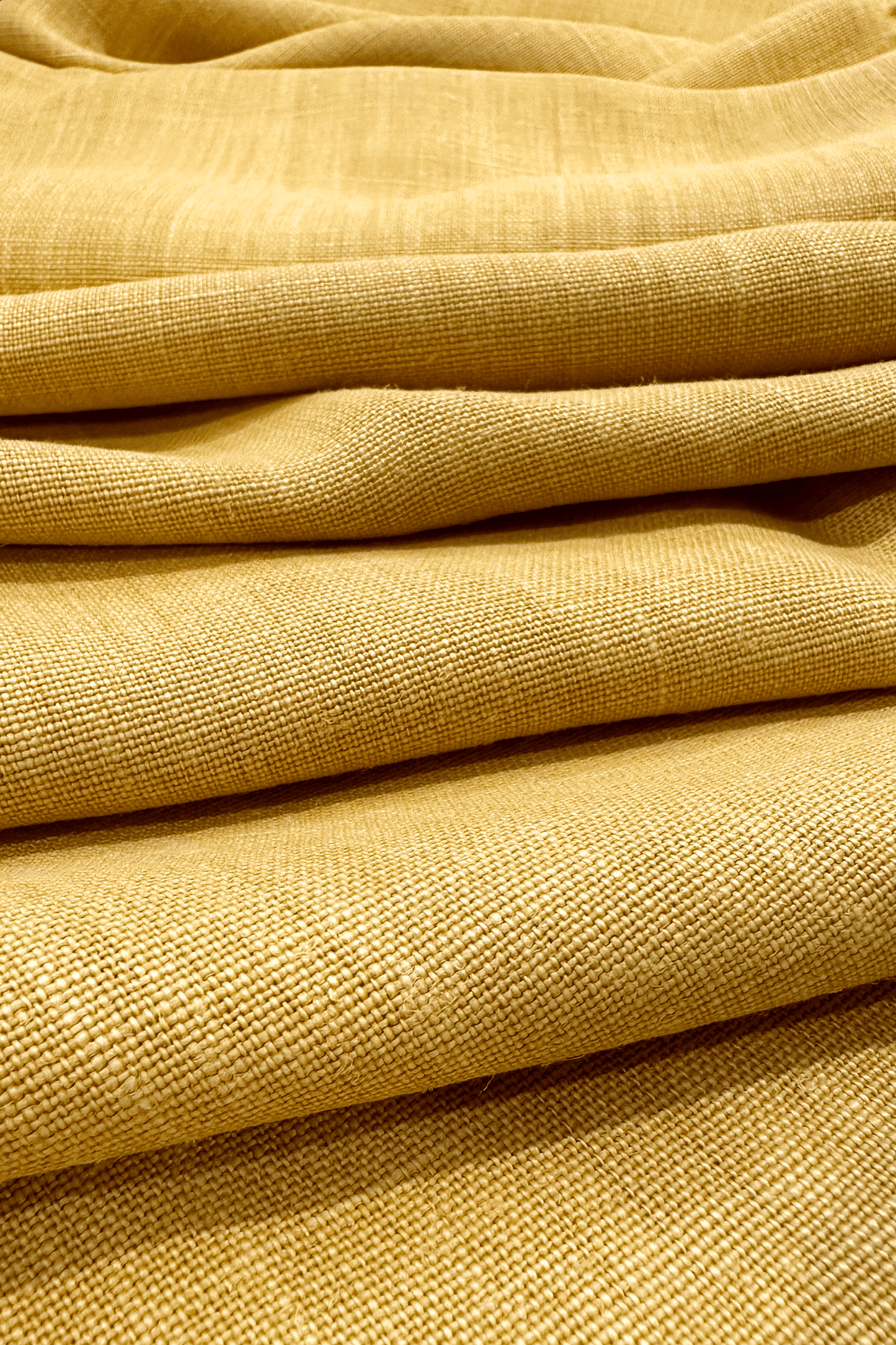 Close-up of premium linen fabric in Wheat colour with a textured pattern