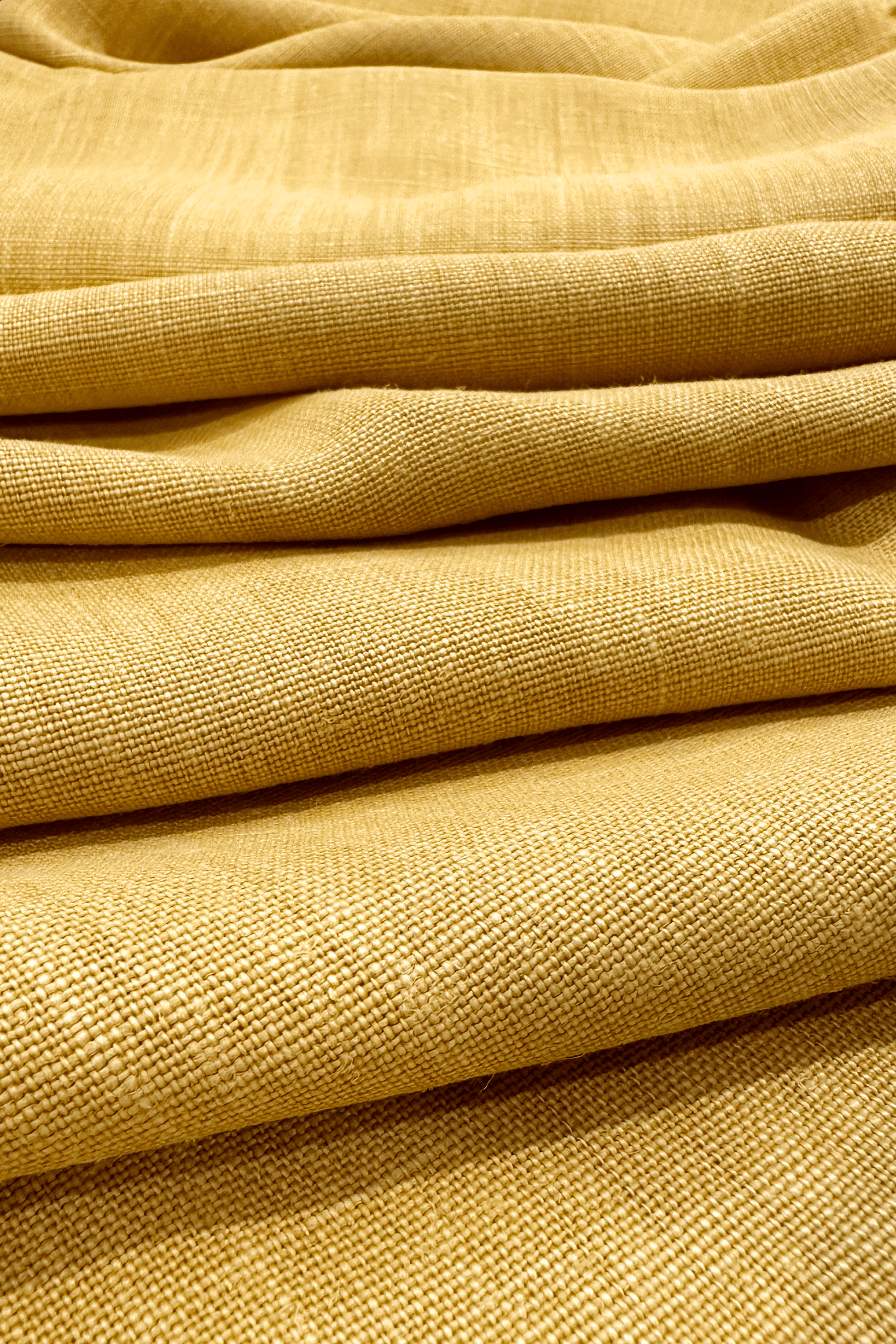 Close-up of premium linen fabric in Wheat colour with a textured pattern