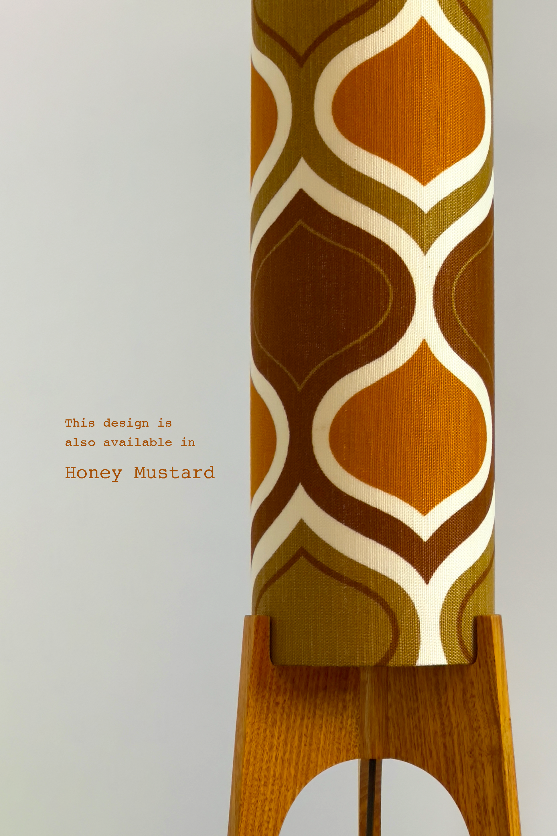 The Mustard Archie Rocket Floor Lamp is a playful nod to the geometric patterns of the 1970s. Handcrafted from authentic vintage fabric and hardwood oak with a patterned shade in Mustard, Brown and Olive